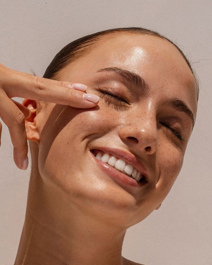 close up-woman-clear skin-smile-sunlight