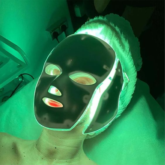 green-led face mask- woman-wearing it-light-front angle