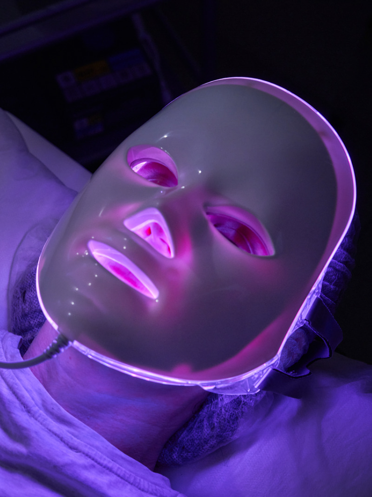 purple- facial mask- above front angle-light-woman wearing it 