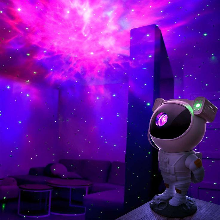 white astronaut- projector- light- galaxy- starry light- side angle- roof- purple light- room