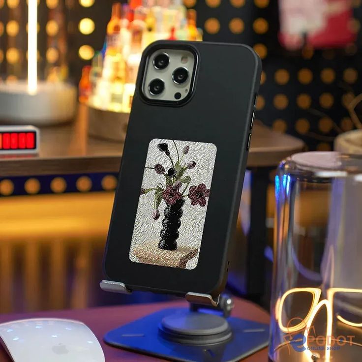 black-ink phone case-front angle- on an stand